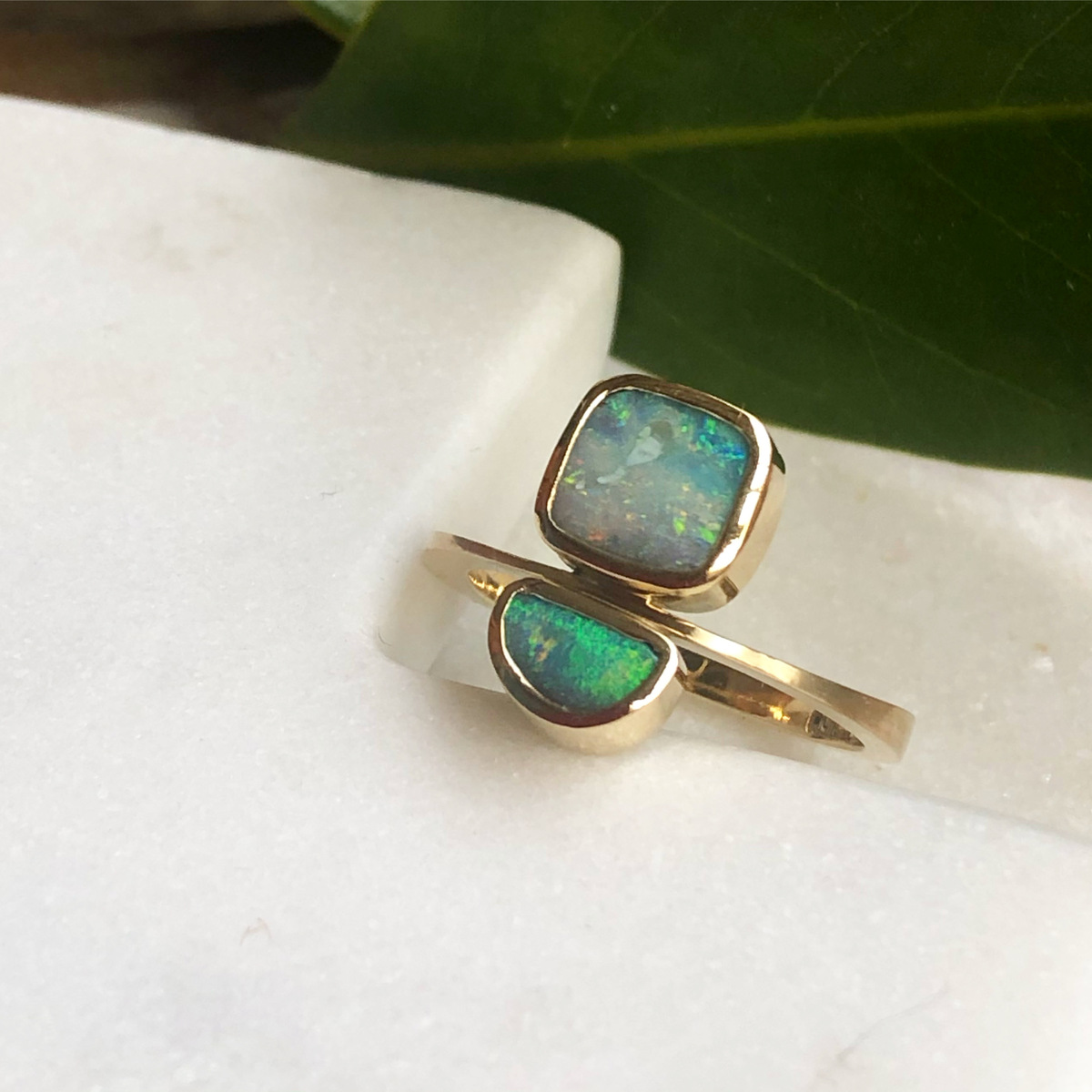 Solid boulder opal paver ring set with two green opals, 