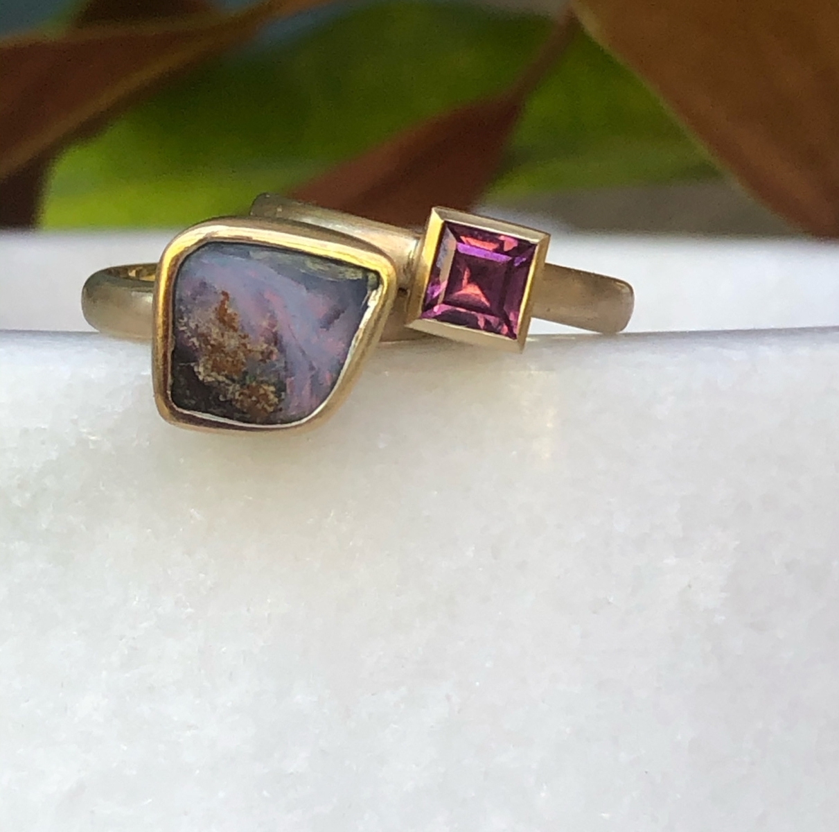 Solid boulder opal ring set with pinkish/purple boulder opal