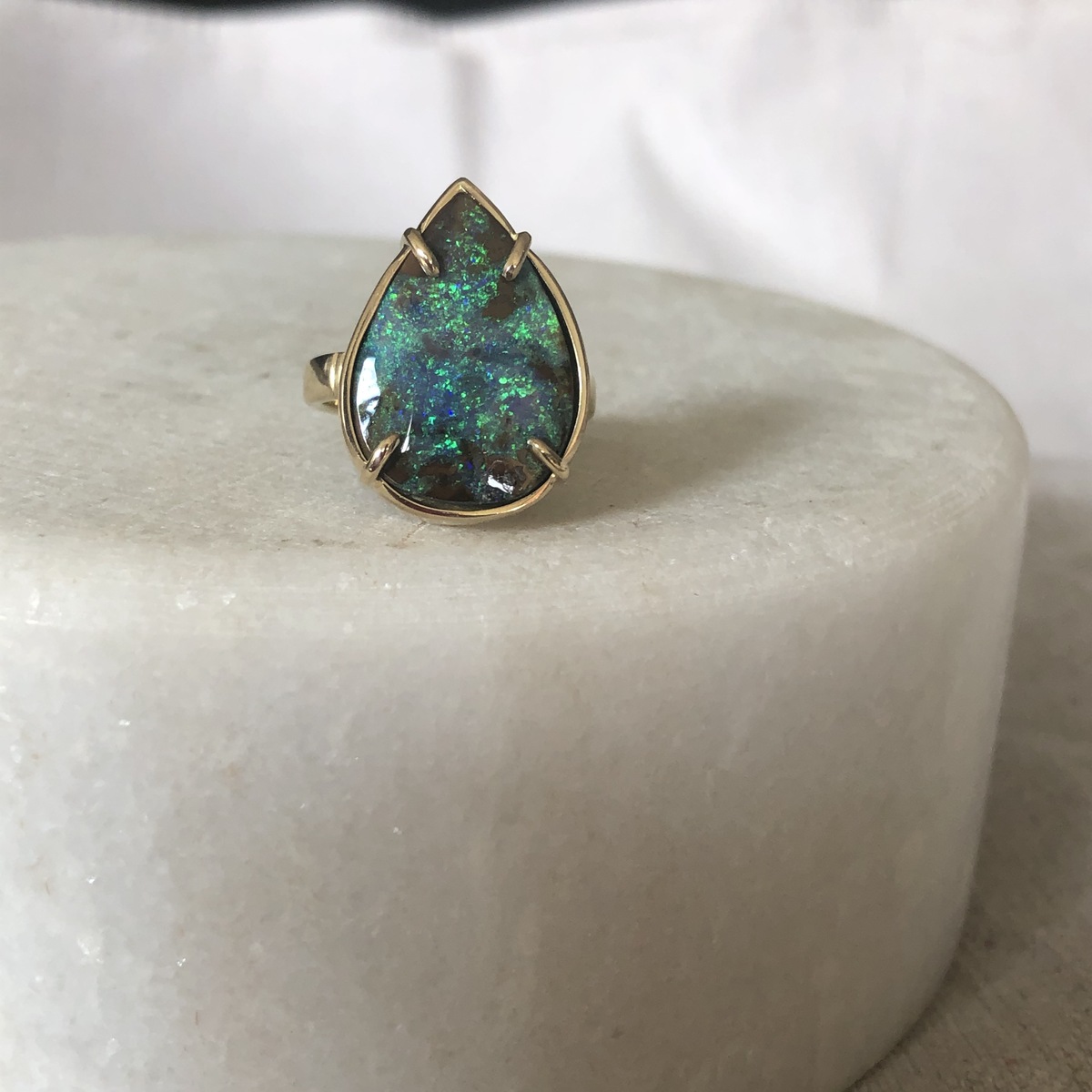 Large tear drop shape boulder opal ring