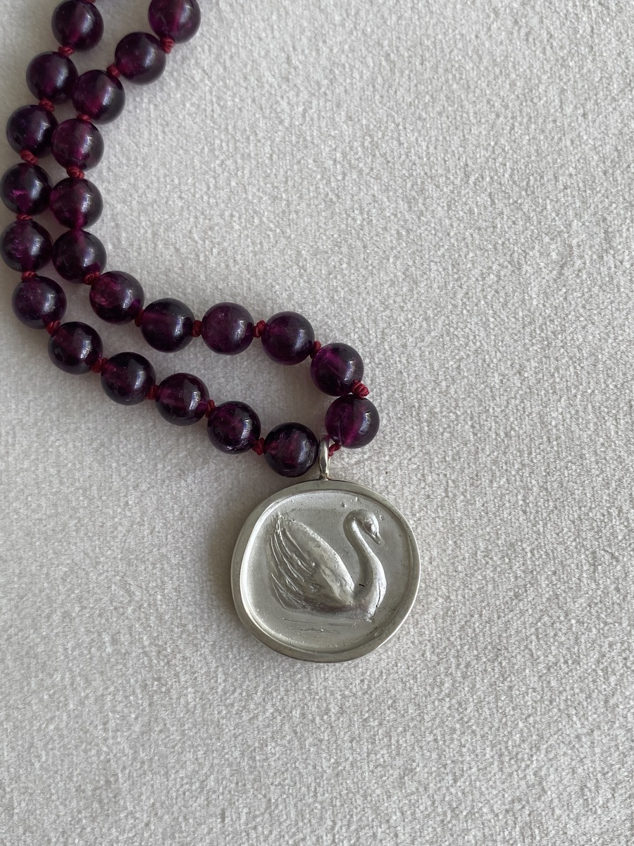 Aria Swan on red garnet beads