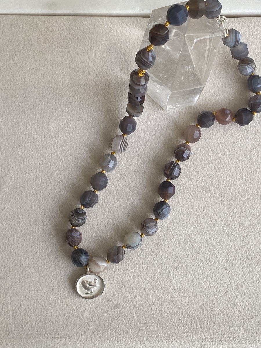 Aria Wren pendant on faceted agate beads