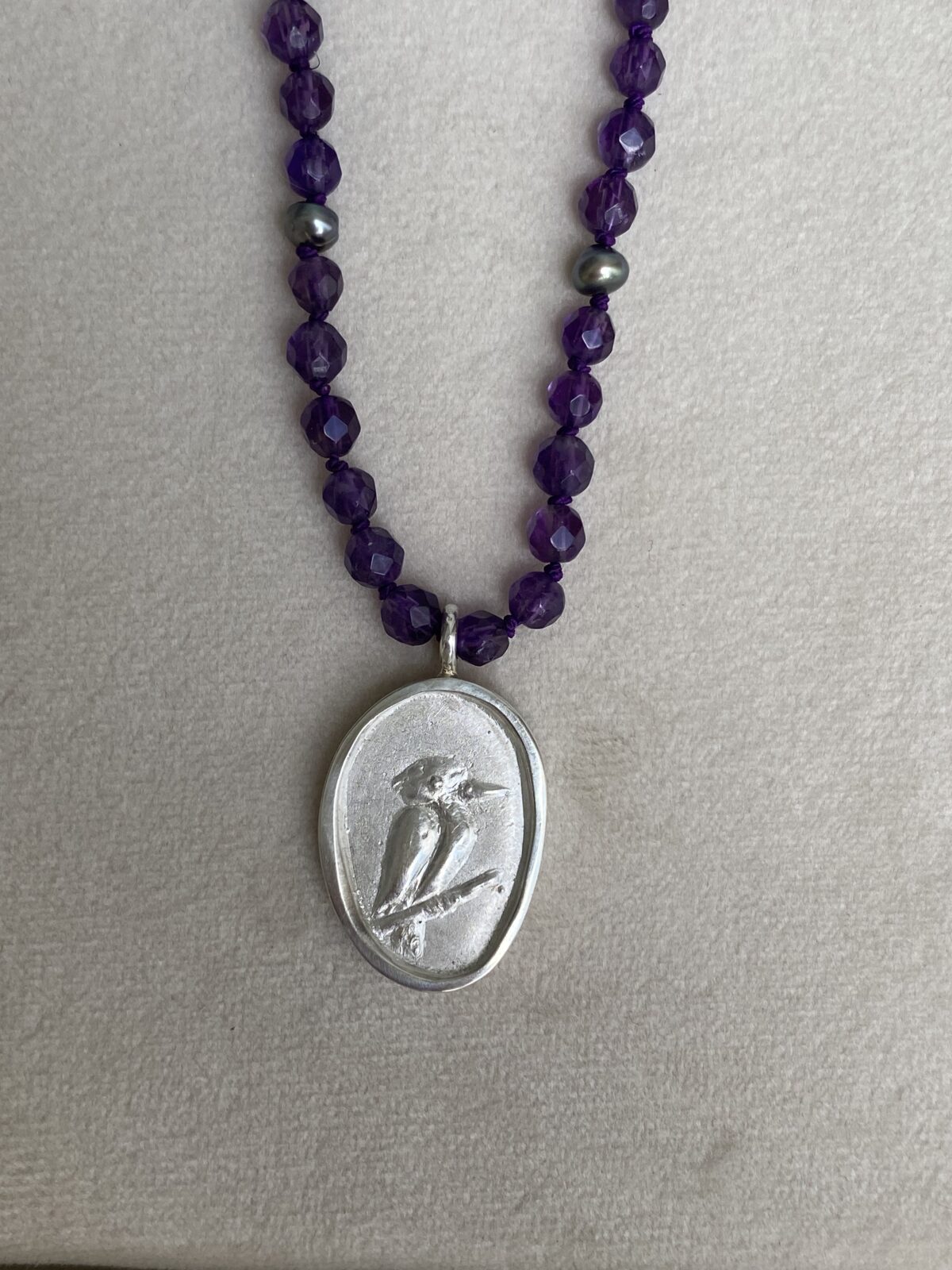 Areia Kookaburra on Amethyst beads
